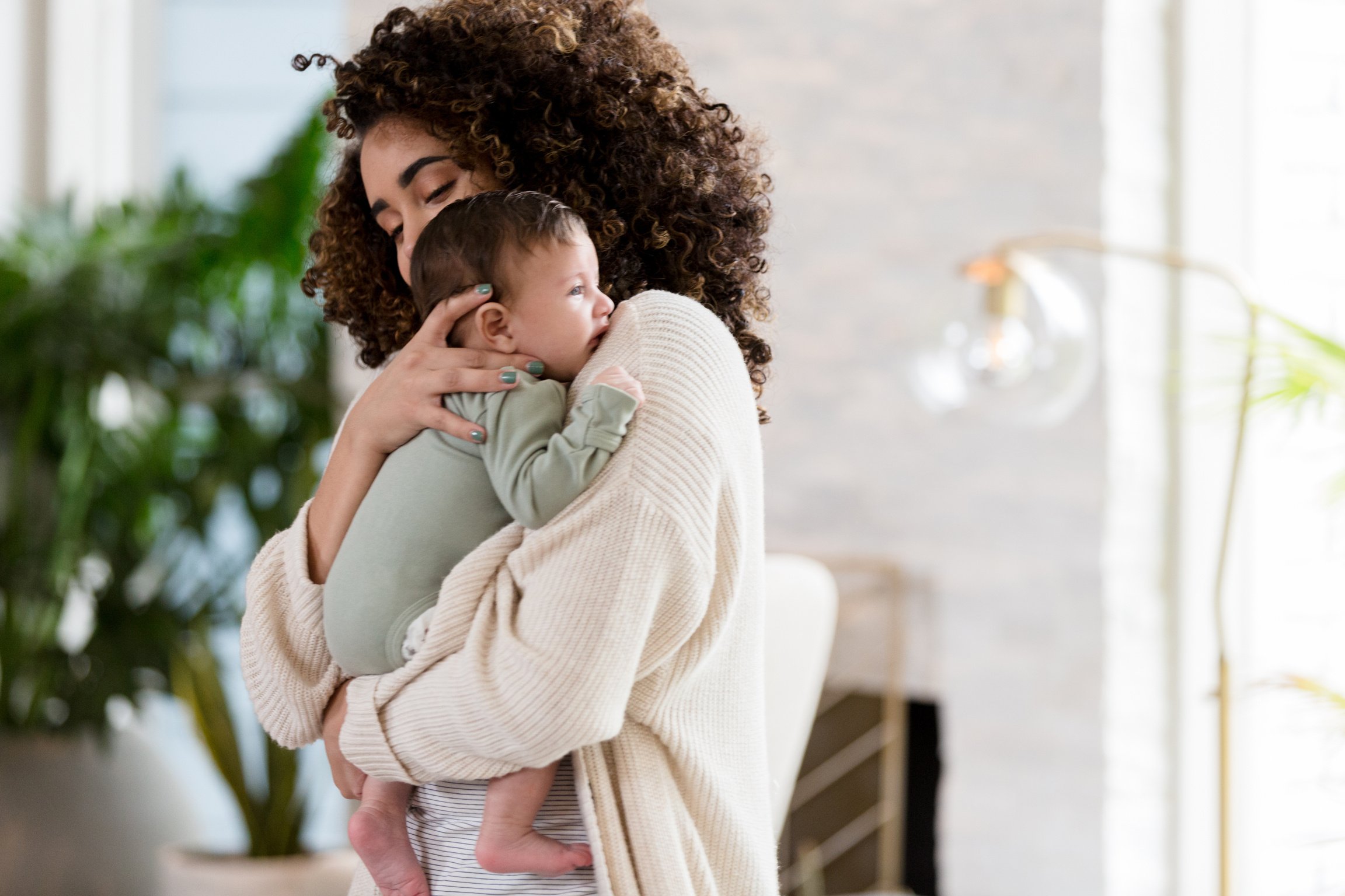 Mom comforts fussy baby